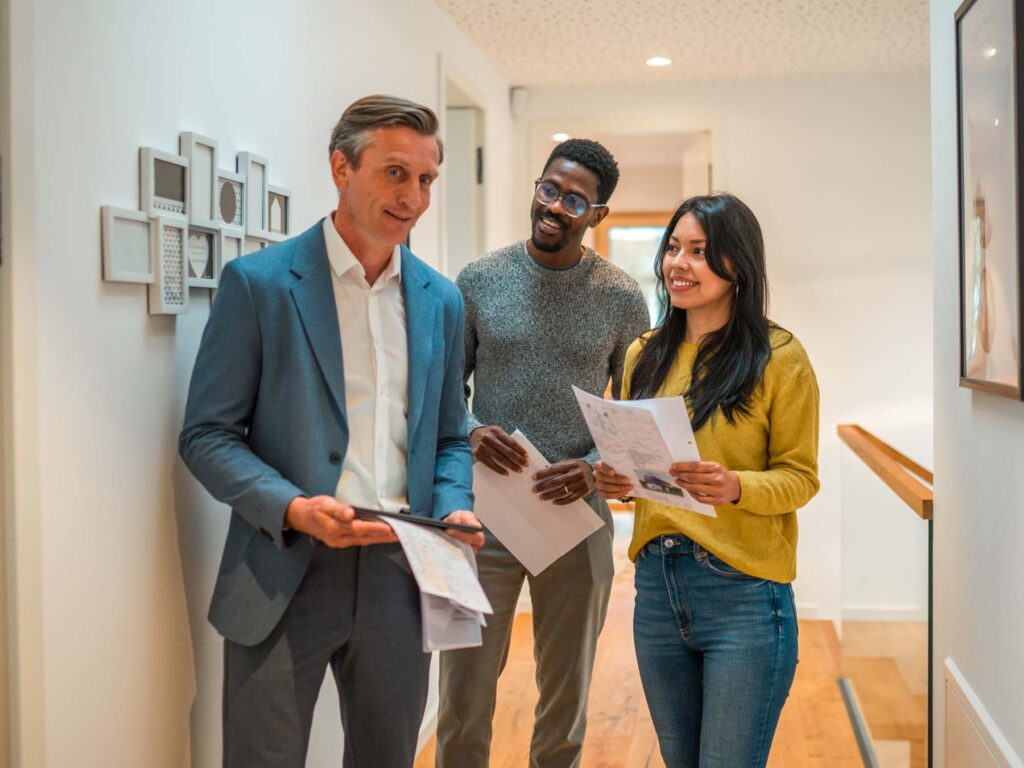 A young couple viewing their first home under a shared ownership scheme with legal help from ONP Solicitors