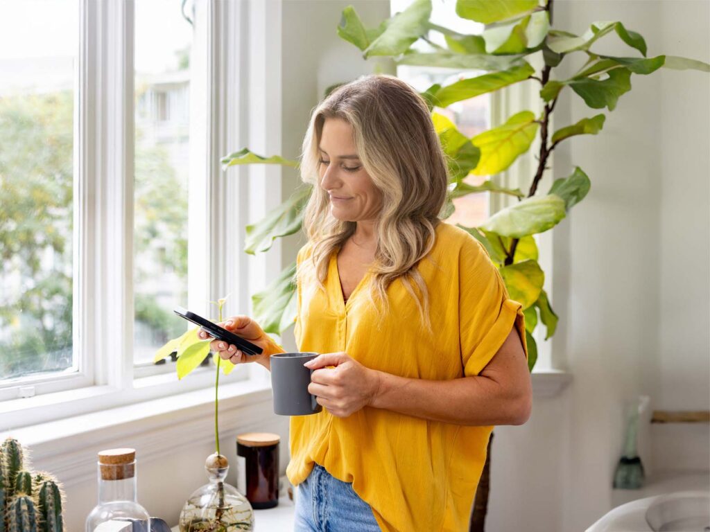 A young woman on her mobile using ONP Solicitor's legal services to arrange a transfer of equity