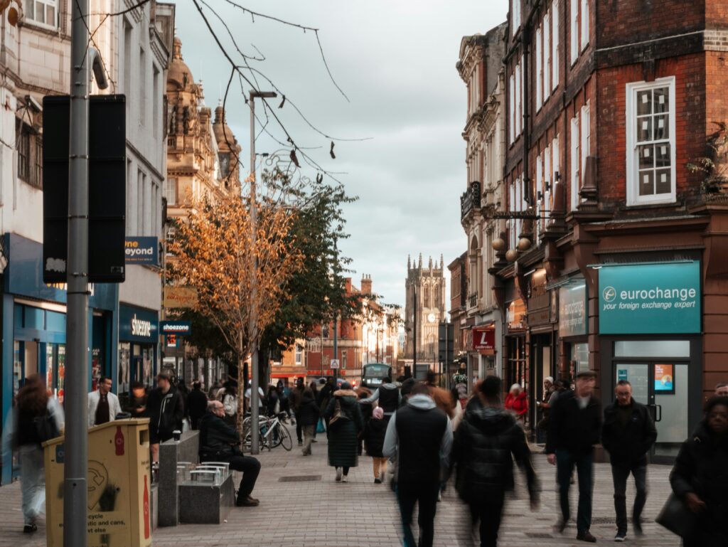 a busy shopping street in leeds city centre